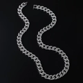 Zilverkleurige iced out Cubaanse schakelketting met sprankelende kristallen in S-vorm - Zilver-Halsketting (50cm)
