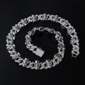 Macro detail of iced-out Cuban link chain featuring skull motifs with hat charms - Necklace (45cm) / Silver
