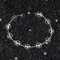 Pulsera de cadena de acero inoxidable pulido con paloma de la paz sobre piedras negras - Plateado (21 cm)