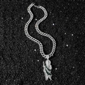 Hip hop St. Jude pendant with green zircons on silver Cuban chain over black stone - Silver Statue With Cuban Link Chain / Silver