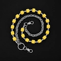 Detail of double-layer hip-hop waist chain with bright yellow dice and silver metal links - Yellow