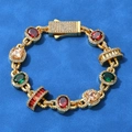 Close-up of hip-hop bracelet with vibrant red and green stones in a luxury micro-pave setting - 9 inches / Gold
