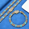 Detail of 8mm gold Cuban link chain set featuring vibrant blue opal stones and white zircons - 7" / Bracelet - Gold