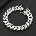 Detailed macro view of polished silver Cuban link chain bracelet on a black textured surface - 22mm x 17.78cm / Platinum