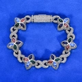 Detailed macro view of silver clover bracelet with multicolor pear-shaped gemstones - Bracelet 7 Inch / Platinum Plated Colorful Zircon