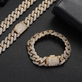 Close-up of iced-out Cuban link chain and bracelet set with sparkling zircon stones - Necklace / 24 inch / Gold