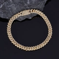 Macro detail of 6mm gold Cuban link chain with cubic zirconia and box clasp - Gold / Bracelet 9 Inch