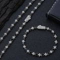Macro shot of silver hip hop jewelry set with black stones and star charms - 24 Inch Necklace / Platinum Black Zirconia (6mm)