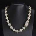 Detail of 15mm gold-tone Cuban chain with iced-out dollar sign money bag links - 40.64cm / Gold