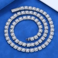 Macro detail of 7mm silver tennis chain with brilliant zircon stones and secure clasp - 24 inch / Silver
