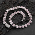 Close-up of pink zircon hip hop tennis necklace with sparkling box clasp on dark background - Width 12mm / Platinum Pink Zirconia / 16 Inches (40.64cm)