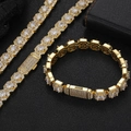 Close-up of golden hip hop chain set with 10mm heart zircon stones on black background - 7 inches (17.78cm) / Bracelet / Gold