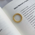 Minimalist adjustable gold beaded ring made of polished sterling silver on a book - Adjustable Open / Gold