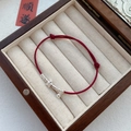 S925 silver red woven rope bracelet with star and bell charms in a wooden jewelry box - 925 Silver / Silver