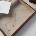 Golden S925 sterling silver necklace featuring colorful floral clovers on a display tray - 925 Silver / Gold