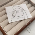 Minimalist S925 sterling silver Chopin chain necklace with lobster clasp on beige display - 925 Silver / White Gold