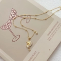 Elegant gold unicorn star pendant necklace with cubic zirconia on a minimalist background - Gold