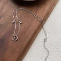 Elegant S999 sterling silver moon and star necklace with shimmering cubic zirconia - 990 Silver / White Gold