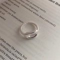 Minimalist S925 sterling silver open oval hollow ring on a vintage book page - Silver