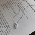 Minimalist S925 silver necklace with marquise cut zircon pendant on a vintage book - 925 Silver / White Gold