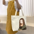 Off-white canvas tote bag with cartoon Mona Lisa print and durable strap for daily use - Mona Lisa / Beige