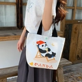 White canvas tote bag featuring a cute panda illustration and black fabric handles - Leisurely Panda