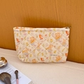 Quilted cream cosmetic bag with cute cartoon animal prints and zipper closure - Little Animals Party