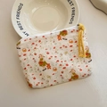 Mini canvas coin purse with hand-drawn girl and floral pattern featuring a yellow rope zipper - Wild Berry Floral Girl