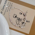 S925 Sterling silver bracelet with pink beads, freshwater pearls and bow pendant - Silver