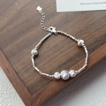 Minimalist S925 sterling silver beaded bracelet with heart pendant on dark wood surface - 925 Silver / Silver