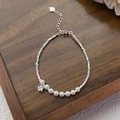 Elegant S925 sterling silver pearl bracelet with star charm and silver beads on wood - 925 Silver / Silver