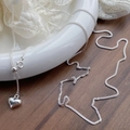 Minimalist S925 sterling silver heart necklace with adjustable sliding chain on a ceramic plate - 925 Silver / Silver