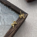 Orecchini a perno con fiocco in argento sterling S999 con elegante finitura dorata - Argento 990 / Oro