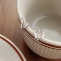 Minimalist S999 sterling silver heart stud earrings displayed on a white ceramic cup - Heart Style (C490)