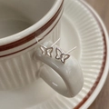 Minimalist S999 sterling silver butterfly stud earrings with hollow design on ceramic cup - Butterfly Style (C492)