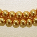 Polished golden glass faux pearls for DIY jewelry making displayed on leather texture - 4mm (100pcs/Pack) / Light Coffee
