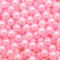 Macro detail of bright pink polished round ABS acrylic faux pearls for DIY jewelry making - Pink