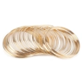 Detailed view of stacked gold-plated steel wire rings for DIY jewelry making accessories - 10 Coils / Plated KC Gold