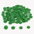 Detail of green resin snap fastener set showing cap, socket, stud, and post components - Grass Green