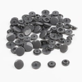 Detail view of gray resin snap buttons showing a complete set of four components on white background - Dark Gray