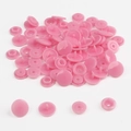 Detailed view of pink T5 resin snap fasteners components on a clean white background - Pink