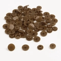Detailed macro view of brown resin snap fasteners for children's clothing DIY sets - Bronze