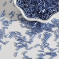 Macro shot of light blue glass bugle beads in a ceramic bowl for DIY jewelry making - Size 3 Bugle 2x7mm / Light Blue