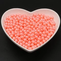 Perle finte rosa lucide per gioielli fai-da-te in una ciotola di ceramica a cuore - Rosa Arancio
