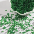 Green transparent glass seed beads for DIY jewelry making in a decorative bowl - Dark Green