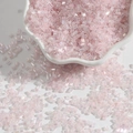 Pink transparent bugle beads with AB luster coating in a ceramic bowl for DIY jewelry - 2mm 15g/Pack Approx 700pcs / Light Pink