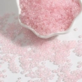 Pink iridescent 2-3mm glass seed beads for DIY jewelry making in a ceramic dish - Light Pink AB
