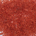 Macro shot of red metallic glass bugle beads for DIY jewelry and necklace crafting - 2x6mm, Aperture Approx 0.8mm, 10g/Pack (Approx 300 Pcs) / Orange Red