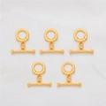 Detail showing five pairs of 18K gold plated toggle clasps for jewelry making - Round Style