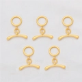 Detailed close-up of five 18K gold-plated OT toggle clasps for jewelry making - Textured Round Style